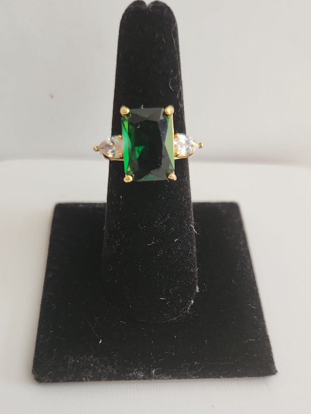 Gold-Plated Ring with Emerald Green Rectangular Stone and Clear Side Accents